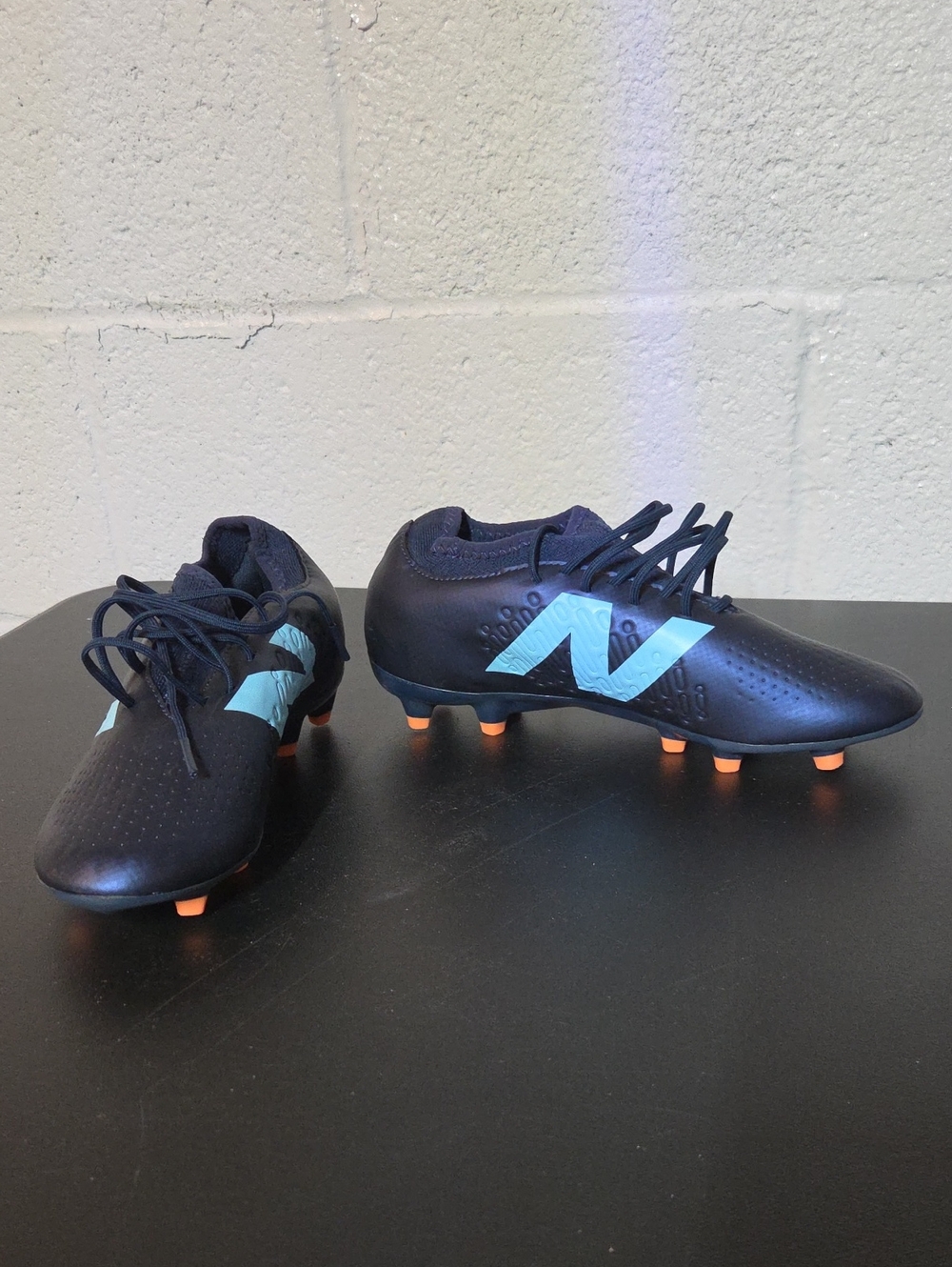 New Balance Men’s Navy Soccer Cleats with Light Blue Logo and Orange Studs